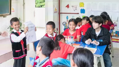 A student presents the results from a group discussion on how to help victims of school bullying to the class at Xinzhai Primary School in Cangyuan, Yunnan Province, on 13 July, 2019.