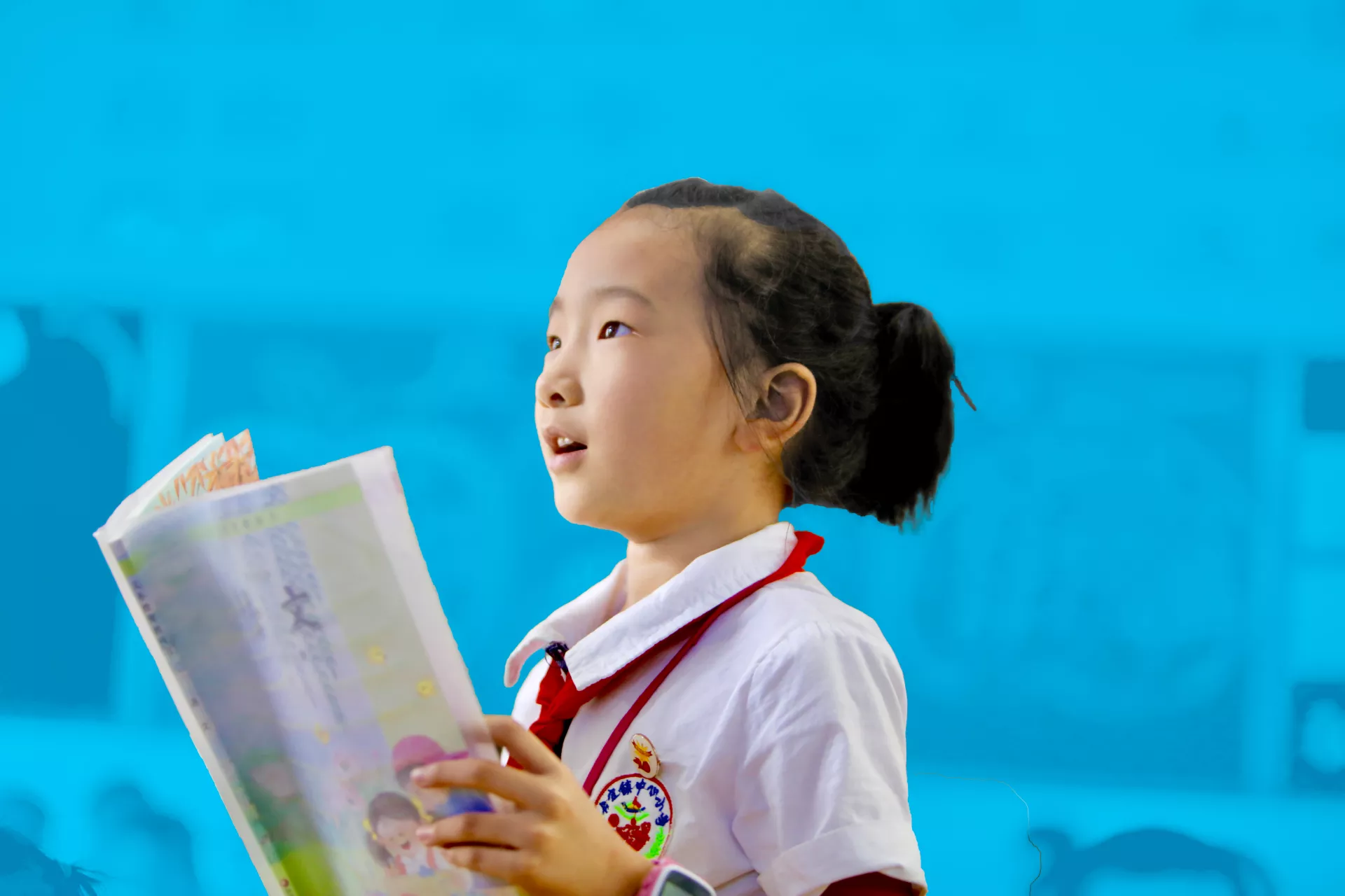 A girl reads during a Chinese class at a school in Sanjiang, Guangxi Zhuang Autonomous Region, in September 2017.