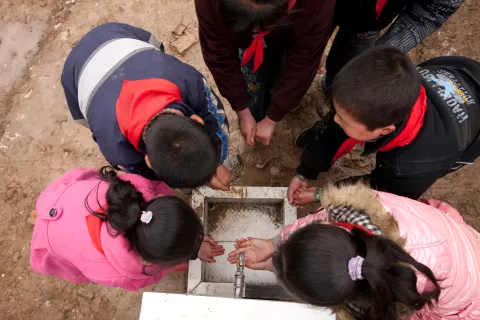 Boys and girls wash their hands during recess at Caochuan Primary School, Xihe County, Gansu Province, China.