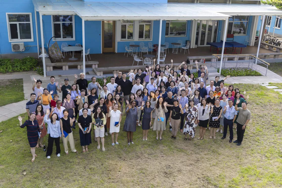 UNICEF Regional Director for East Asia and the Pacific Debora Comini (R8, 1st Row) joins UNICEF China staff in a group photo at the UNICEF China compound in Beijing in August, 2023.
