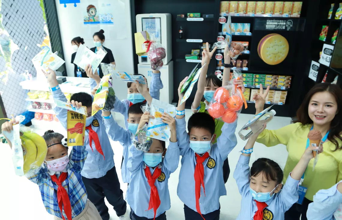 At the end of the tour, children wave to the camera with special takeaways from the store, puzzles in the shape of a pack of potato chips, and more importantly, knowledge to make healthier food choices in their lives.
