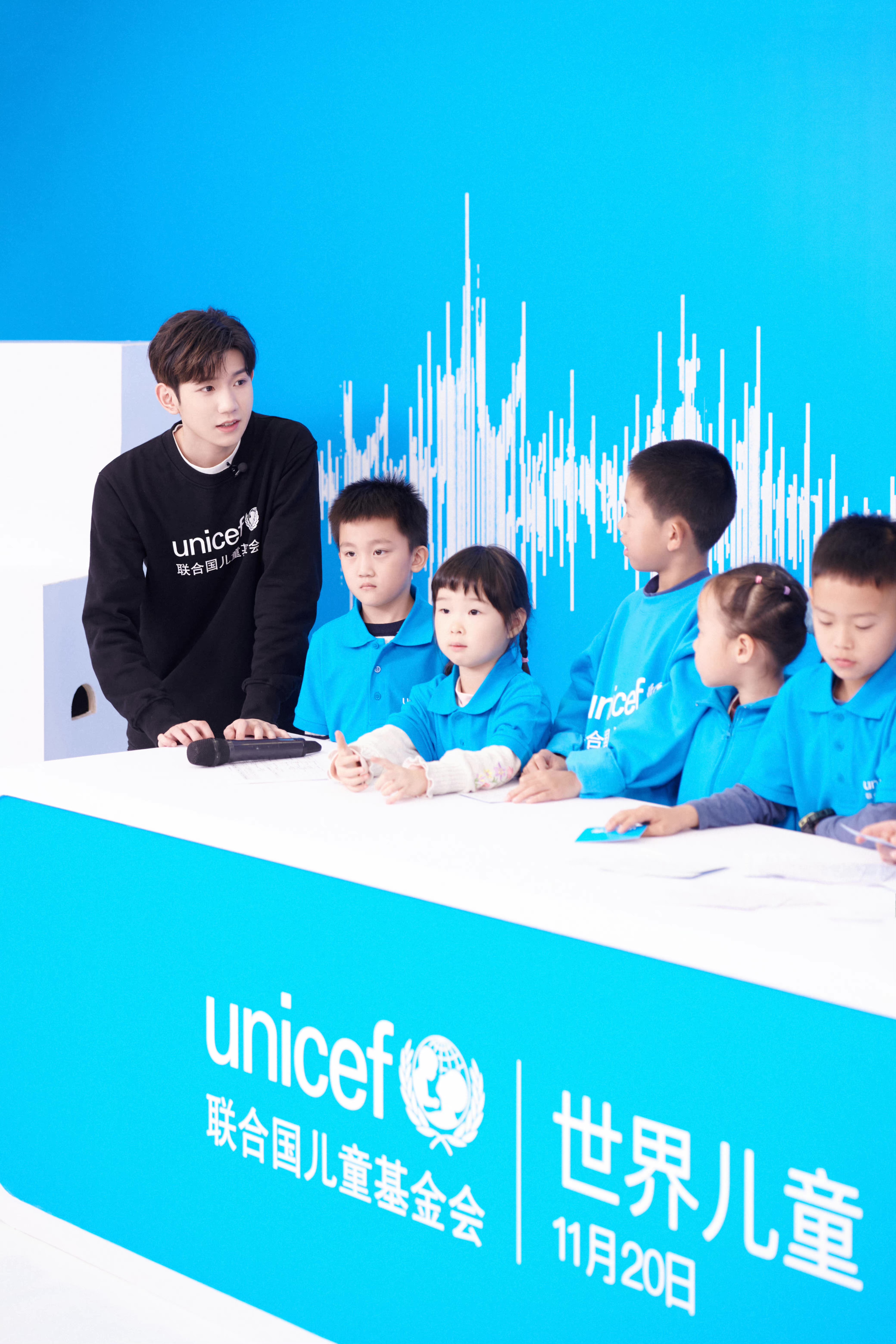 UNICEF Ambassador Wang Yuan teaches children to sing the World Children’s Day theme song ‘In the Future’ during a livestream in celebration of the day in a studio in Beijing on 20 November 2021. The song, written by Wang Yuan, was released earlier on the day. It was inspired by his hopes for the future of children and young people.