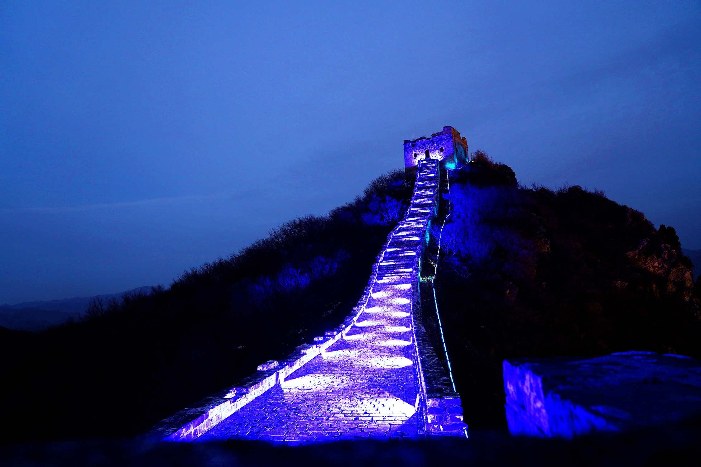 A section of the Simatai Great Wall in Beijing is lit up in blue to mark World Children’s Day on 20 November 2021. A total of 23 cities lit up in blue iconic buildings and monuments to symbolize their commitment to upholding children's rights.