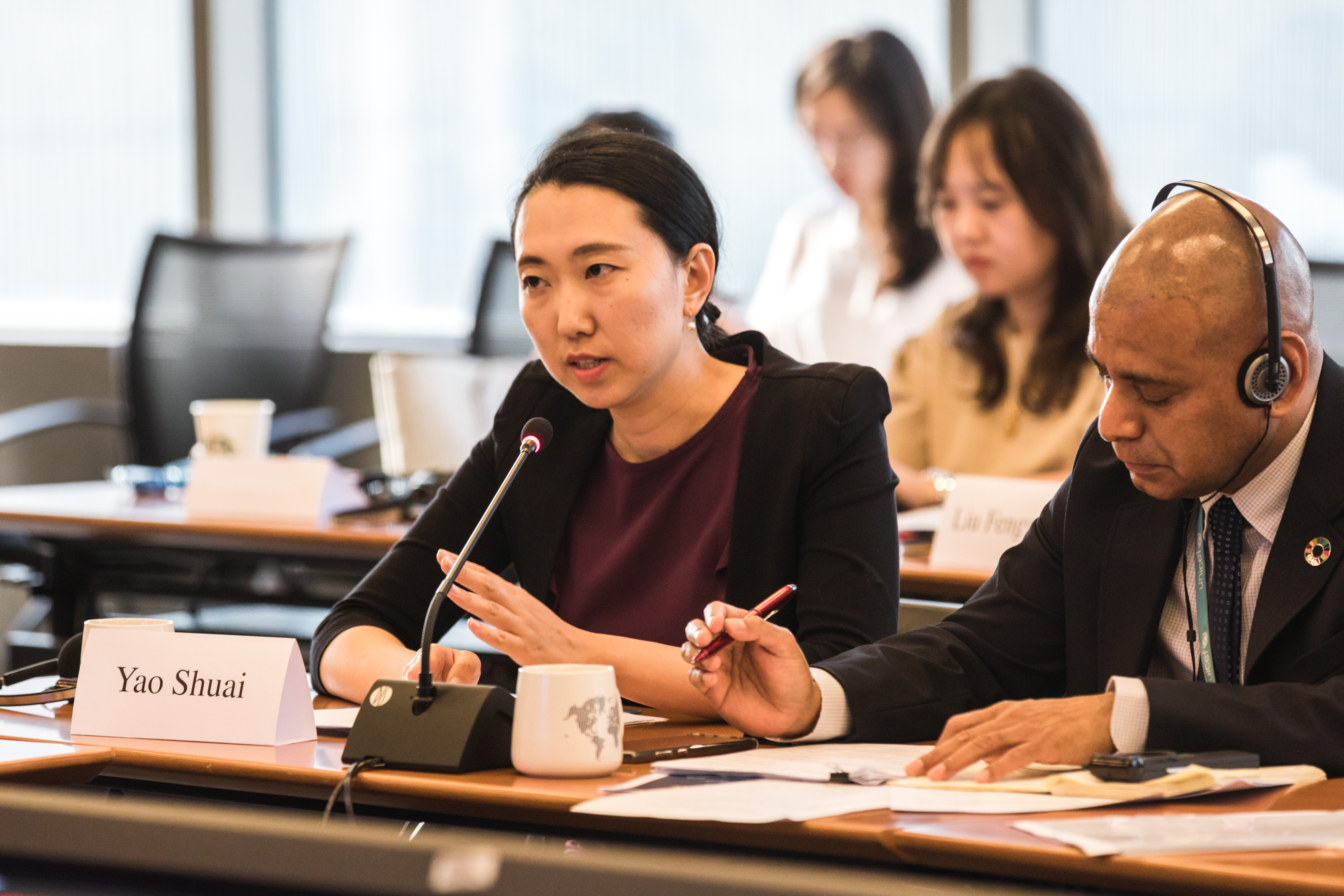 Dr. Yao Shuai (left), Deputy Director of the Institute of International Development Cooperation, Chinese Academy of International Trade and Economic Cooperation, speaks at the launch event of the report at World Bank’s Beijing Office on 9 July 2021.