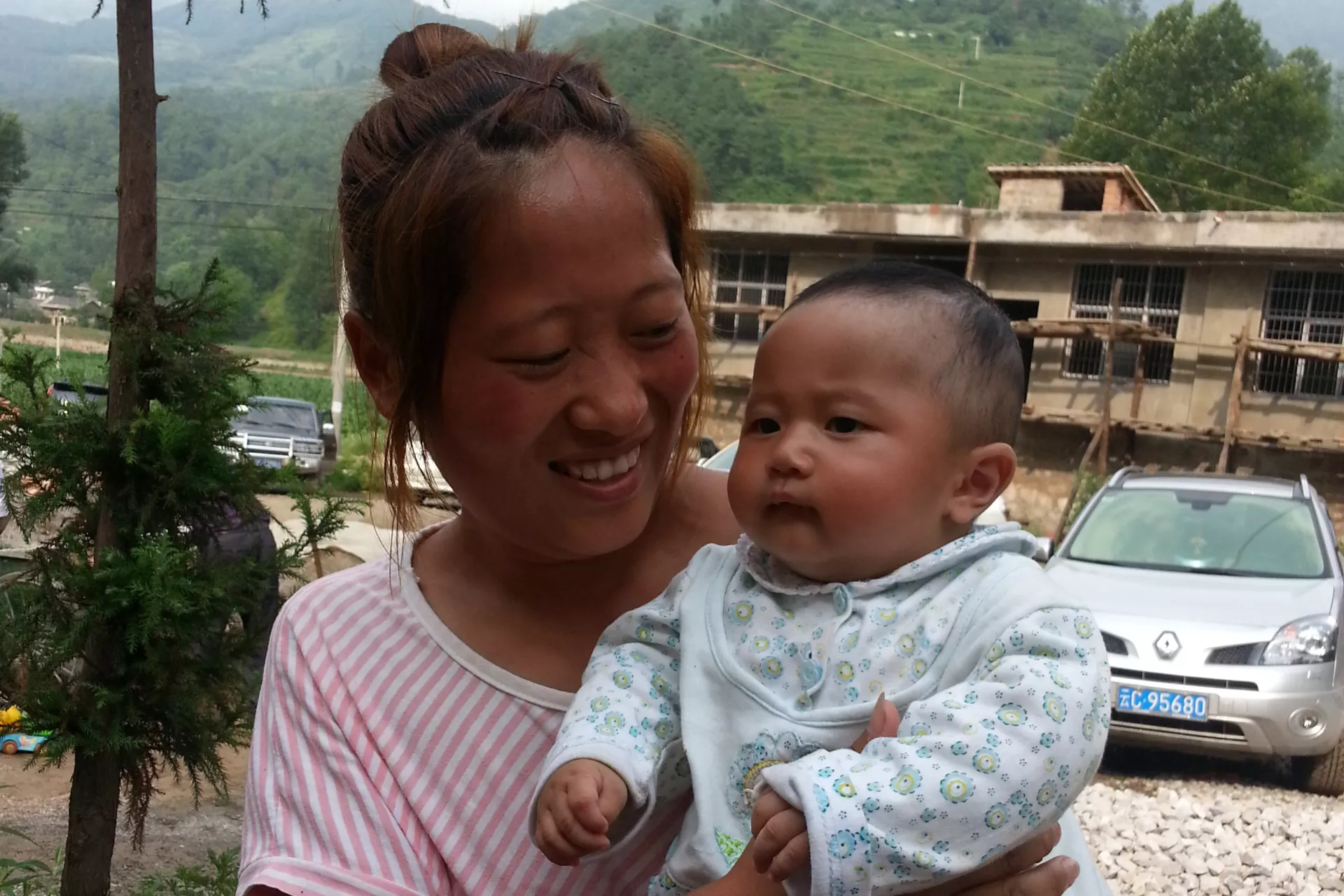 Zhao Yinlian, a 24 years old mother of 4 months old boy, from Sanzhai village of Zhaoyang district, Zhaotong city of Yunnan Province.