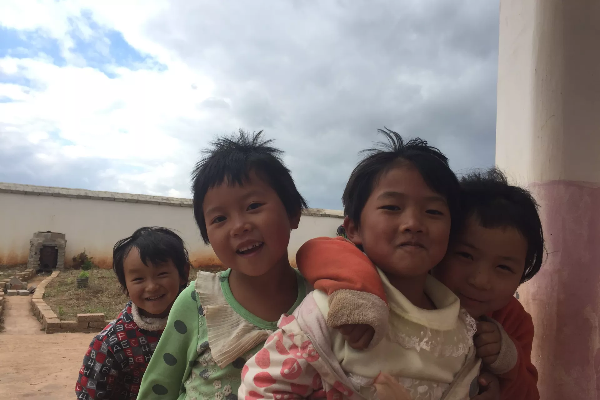Children at Eyi Kindergarten in Yunnan Province pose for photos.