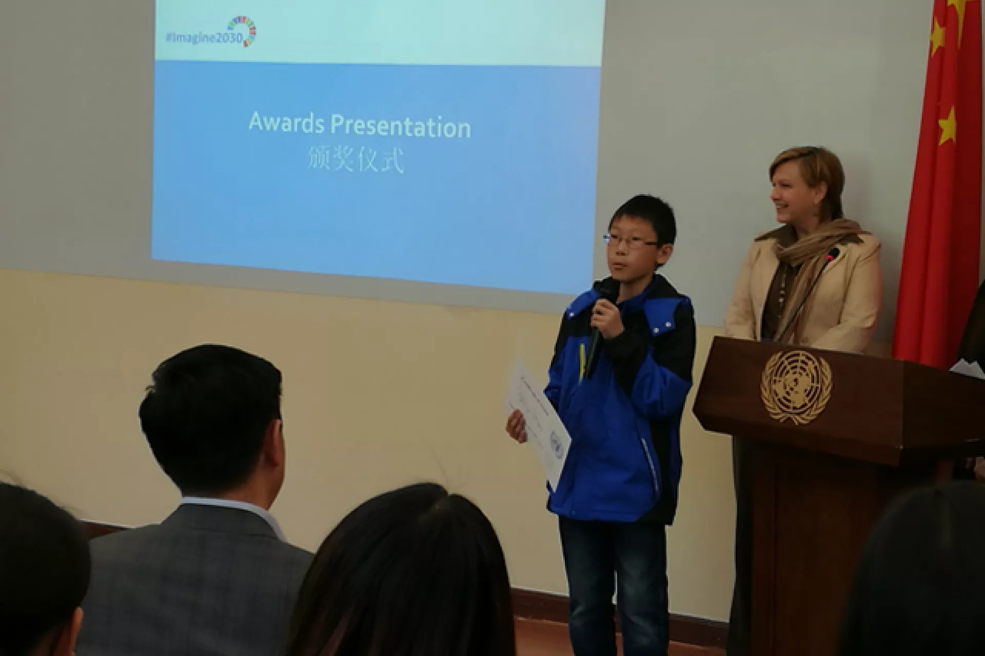 Zhang Qingze, aged 12 from Shandong Province, talks about his award winning art piece on SDG Goal 1.