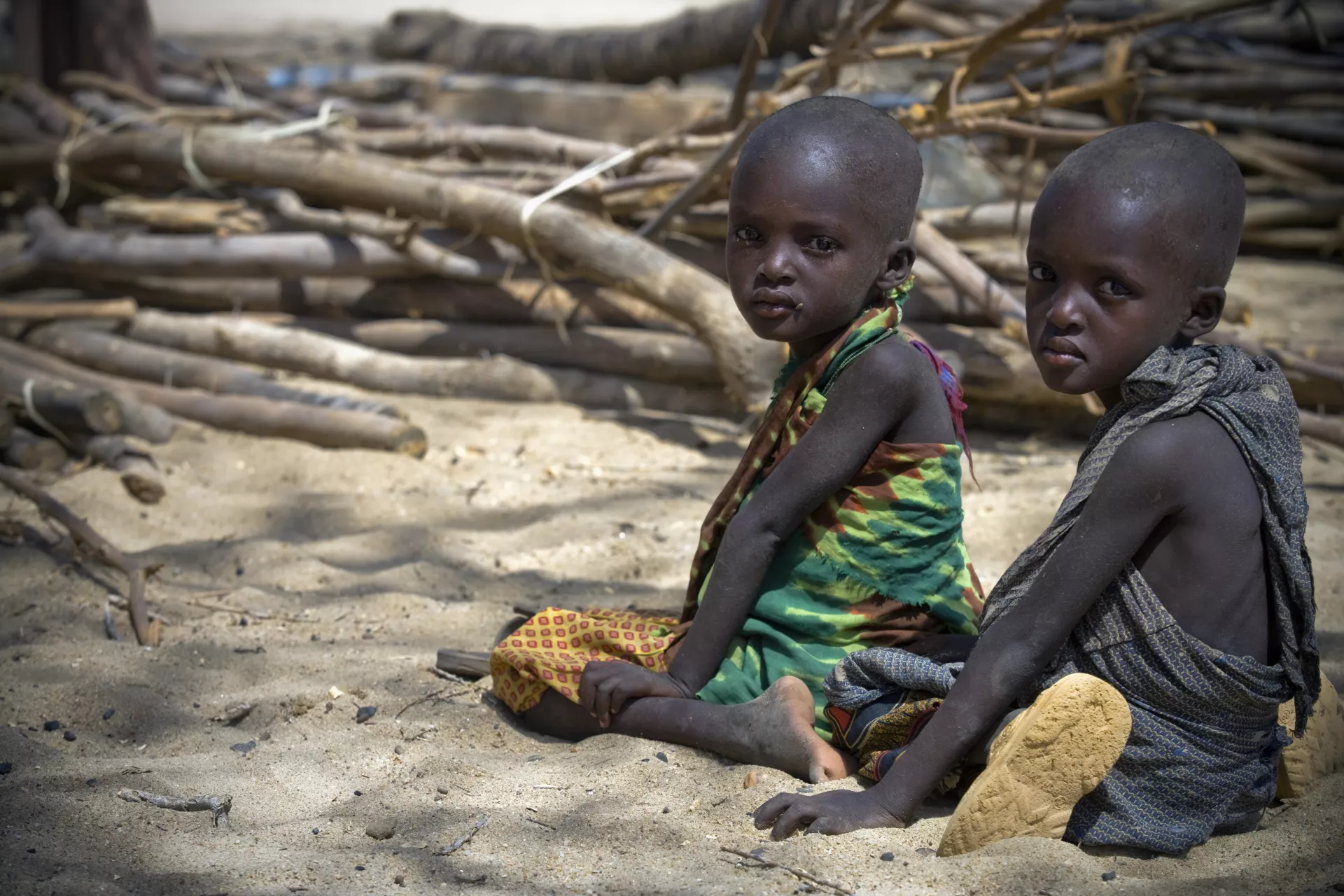 Two children wait for nutrition screenings at a UNICEF-assisted health centre near the town of Lodwar, capital of Turkana District, in Rift Valley Province.