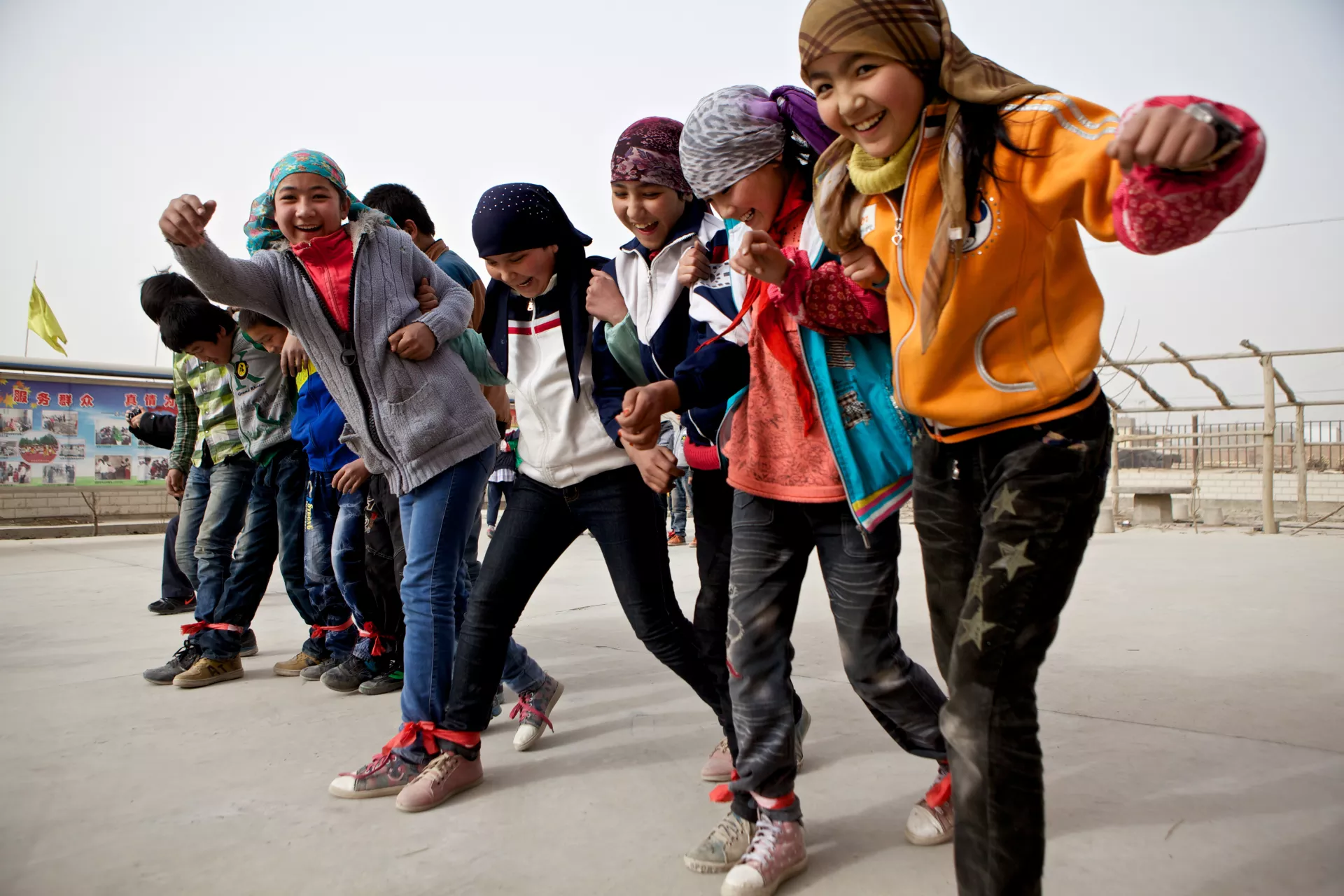 A group of children enjoying a group game organized at the Aksu Rescue Centre for Minors.