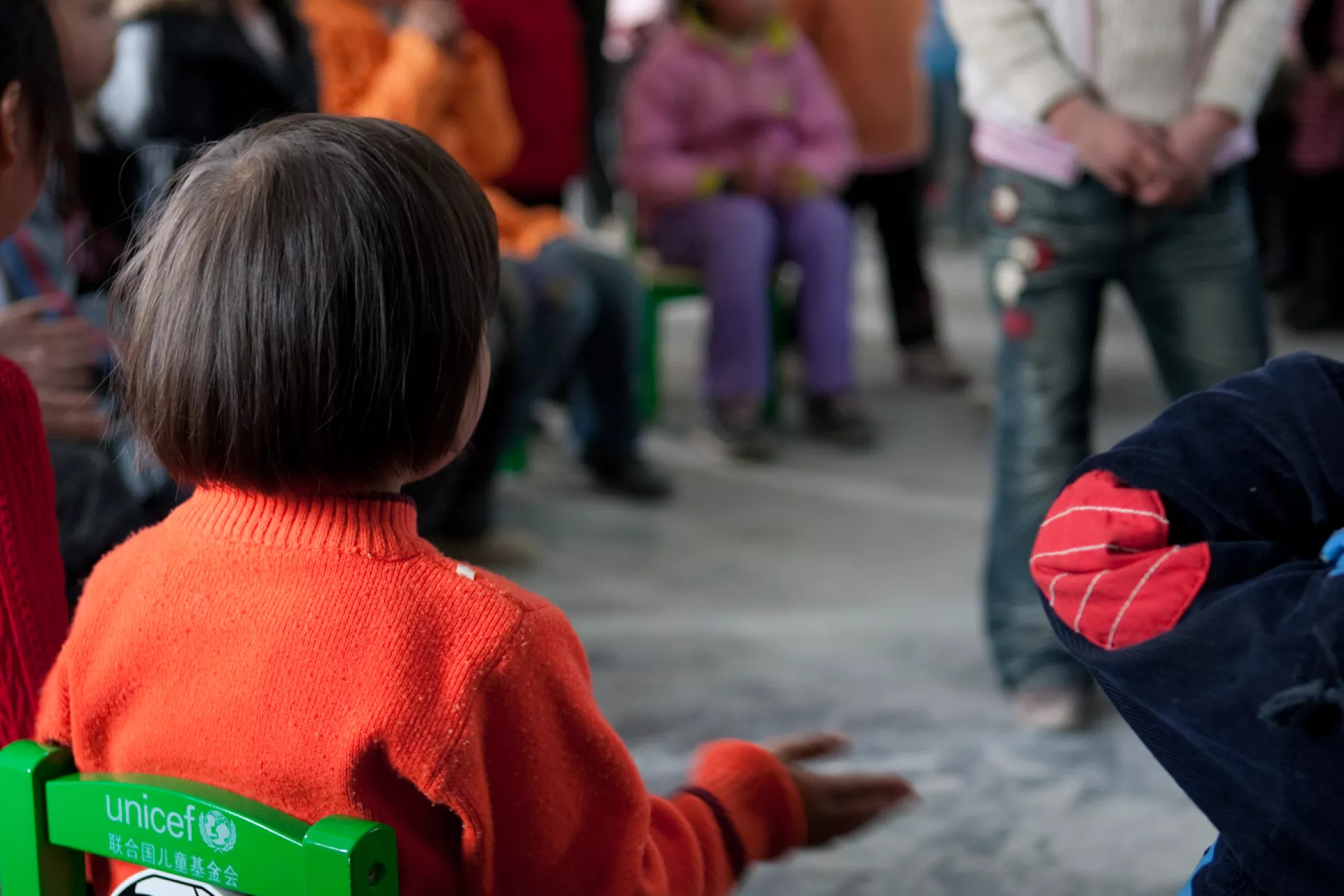 Doudou (front left) plays a game with her peers in a UNICEF-supported Child Friendly Space in Beichuan County.