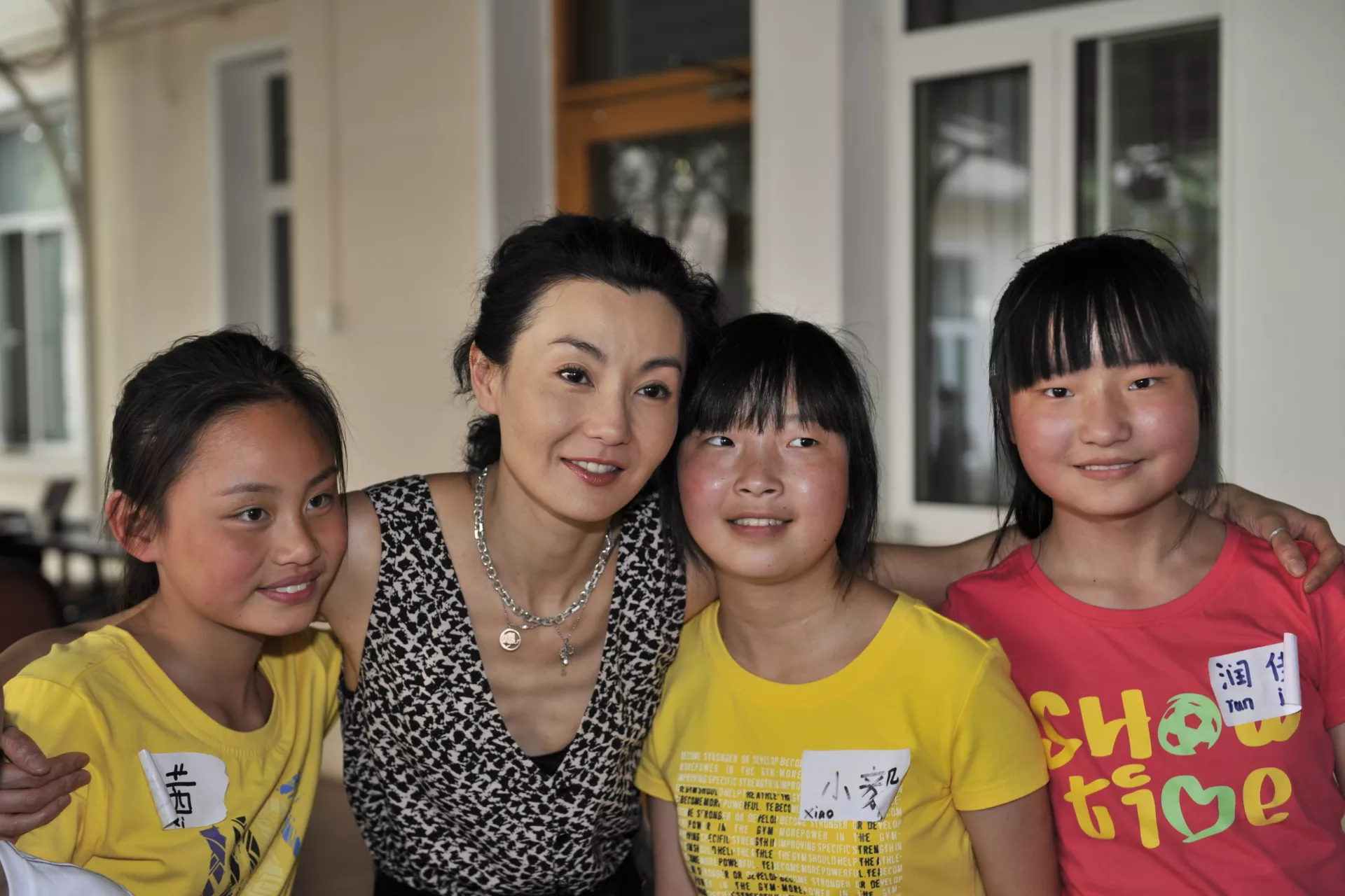 Maggie Cheung and the young presenters, including Xi-xi (far left).