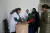 2015年1月15日，在四川省凉山彝族自治州昭觉县竹核乡卫生院，一名医生给一名孕妇测量血压。