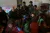 2015年1月15日，在四川省凉山彝族自治州昭觉县木渣洛村的儿童之家，联合国儿童基金会驻东亚及太平洋地区主任丹尼尔•图尔（Daniel Toole）坐在当地儿童中间。
