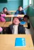 A boy laughs during a class session.