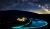 2023年11月20日，甘肃敦煌月牙泉以蓝色灯光点亮，庆祝世界儿童日。