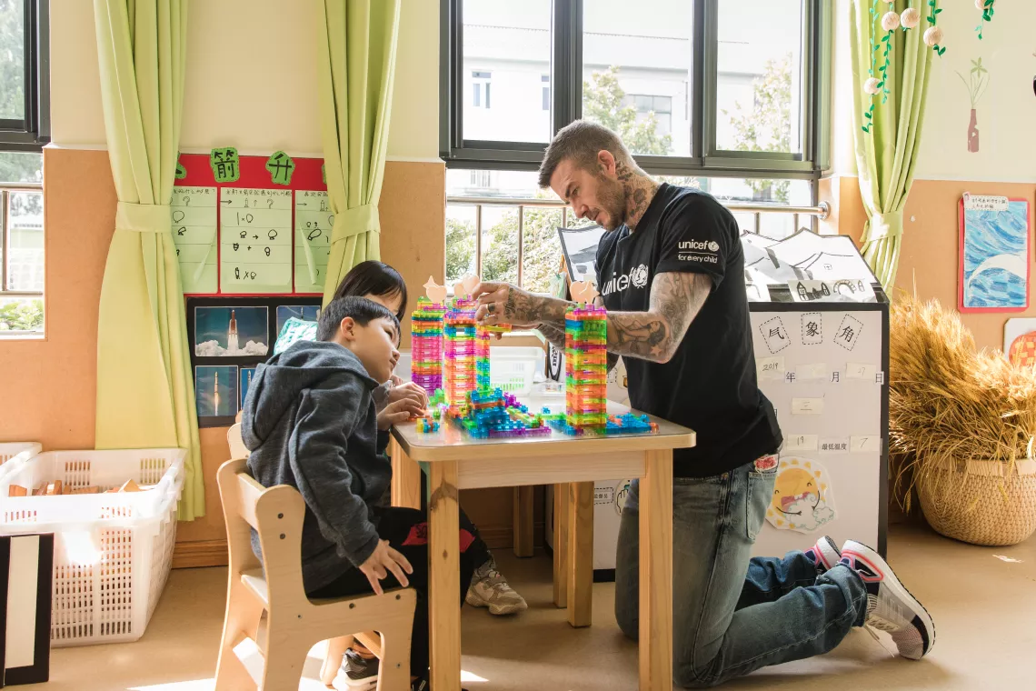 UNICEF Goodwill Ambassador and Global Icon David Beckham and two 6-year-old children play with building blocks during a visit to Xianghuaqiao Kindergarten on the outskirts of Shanghai, China, on 27th March 2019.