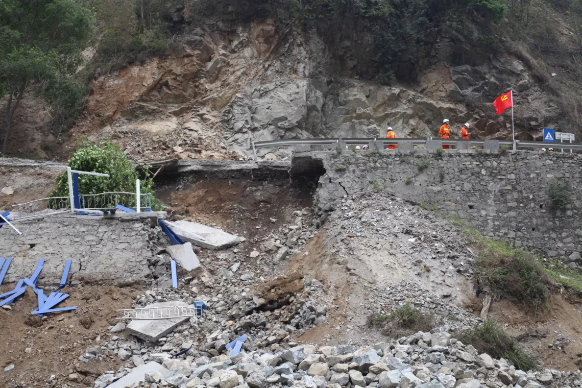 April 21, 2013, a mountain road damaged as a result of a landslide in Lingguan Township, Lushan County.