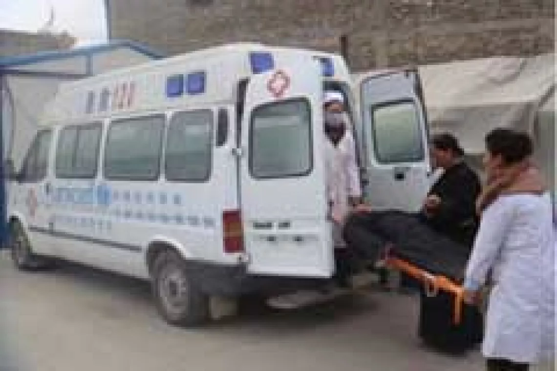 An ambulance provided by UNICEF is transfering a woman to hospital.