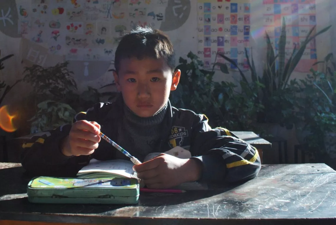 Binbin, age eight, lives with his grandmother.