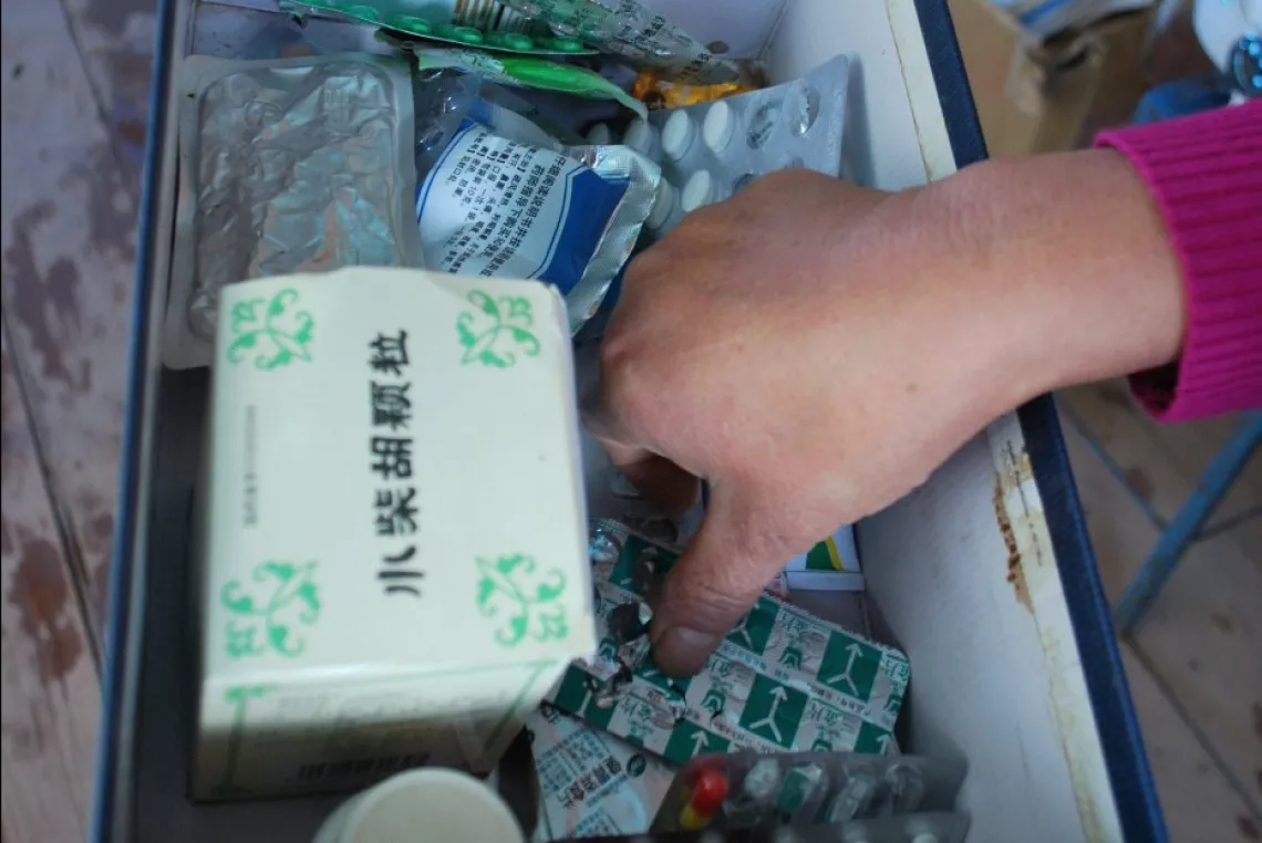 Teacher Xiong keeps medicine for minor diseases to give students when they are sick in class.
