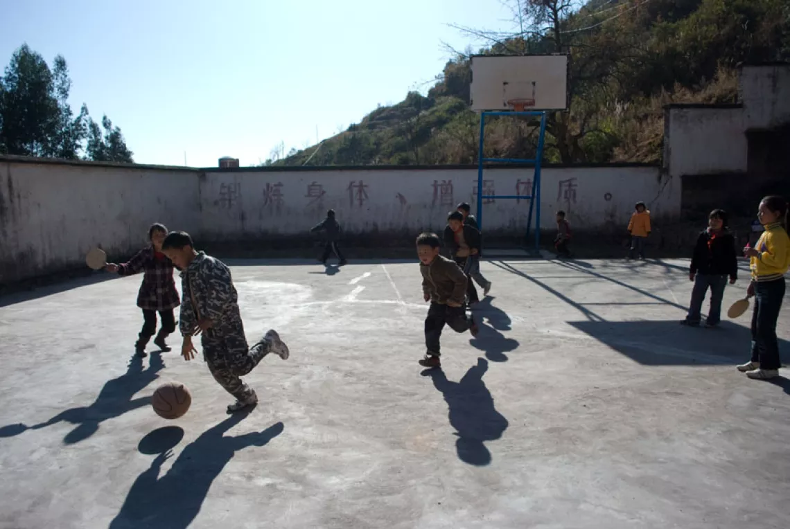 Children play sports at the playground of Meihua Primary School.