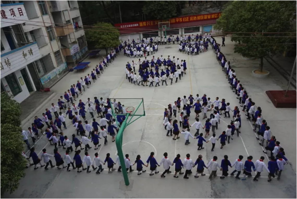 Performance by students and teachers at Bajiang Central Primary School, Sanjiang County