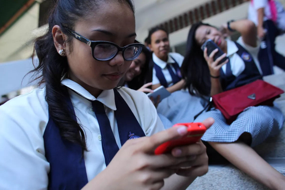 Jan, 16, with other girls using their mobile phones after classes, followed advice from an online post about using self-injury as a way to cope with depression, peer pressure and cyberbullying.