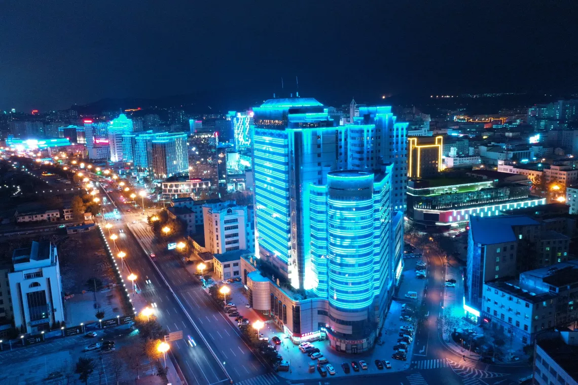 Buildings in Weihai, Shandong Province, light up in blue on 20 November 2020. In China, 14 cities across the country are celebrating World Children's Day by hosting events and lighting up buildings and iconic monuments in blue.
