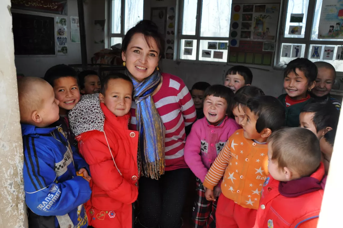 A school teacher and her students in Yutian county.