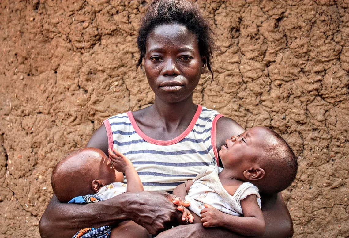 Mapundo, a resident of Uvira in South Kivu province, and her twins Bukuru and Butoto.