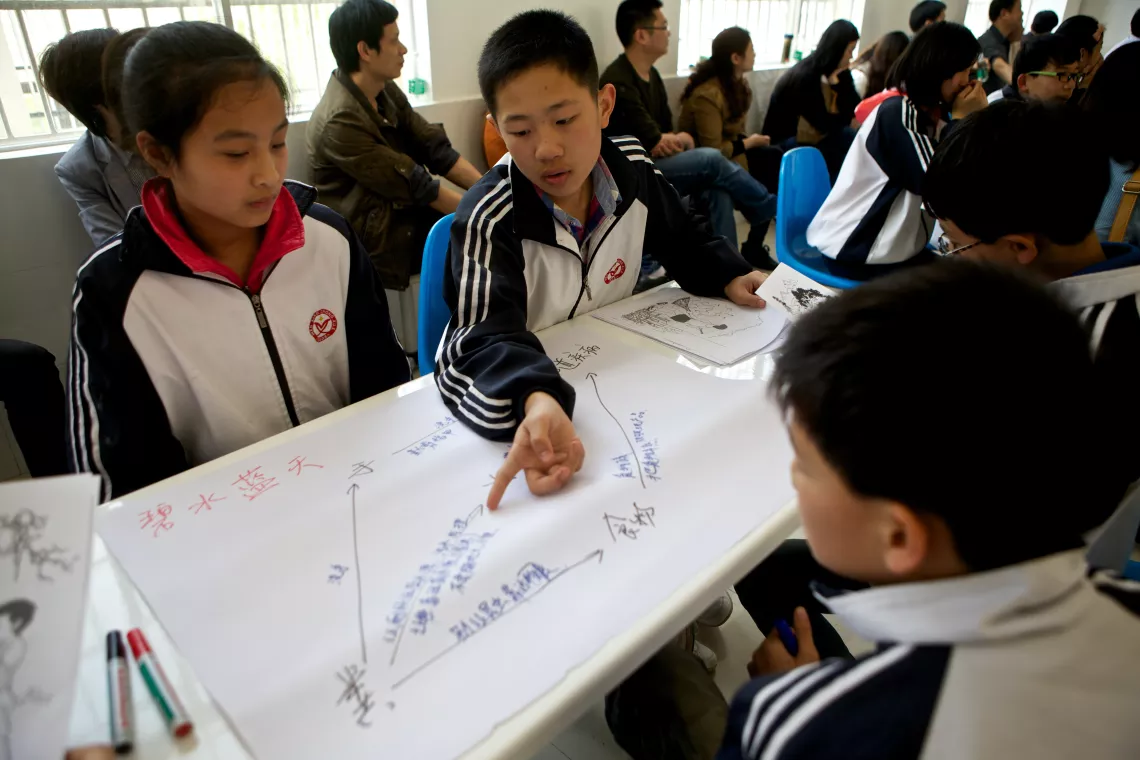 Students participate in a group discussion on sanitationat a middle school in Hunan Province in 2013.