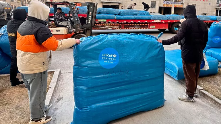 On 21 December 2023, in Wuxing District, Huzhou City, Zhejiang Province, emergency supplies provided by UNICEF are being packed and ready for dispatch to Jishishan County, Gansu Province, to assist children affected by the disaster.