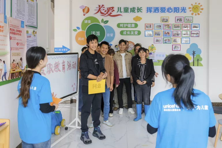 UNICEF Ambassador and renowned actor Chen Kun joins a positive parenting session with a group of caregivers at the Children’s Place in Dalu Village, Lingshan County of Guangxi Zhuang Autonomous Region, on 13 May 2023. During his trip to Lingshan Country, Chen Kun met children and caregivers taking part in the Integrated Child Protection Model programme jointly supported by UNICEF and the Ministry of Civil Affairs.