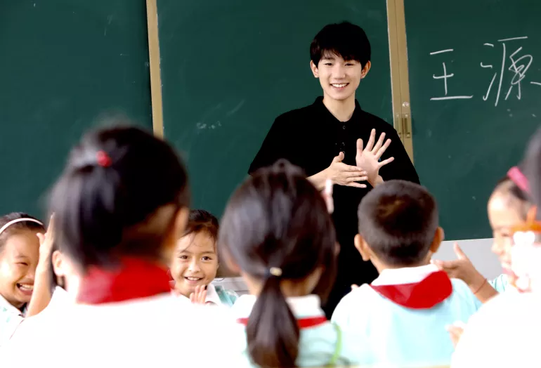 UNICEF Special Advocate for Education Wang Yuan gives a music lesson to the students at a child-friendly school in Sanjiang, Guangxi Zhuang Autonomous Region, in September 2017. Wang Yuan made his first visit to the Child-Friendly Schools programme, jointly supported by UNICEF and the Ministry of Education in the remote rural communities in China, at the start of the new school semester.