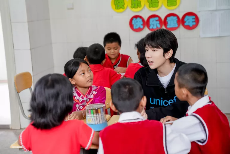 UNICEF Ambassador Wang Yuan joins a group discussion in a Social and Emotional Learning lesson during his visit to Xinzhai Primary School in Cangyuan, Yunnan Province, where UNICEF is implementing a Social and Emotional Learning project, on 13th July, 2019. 