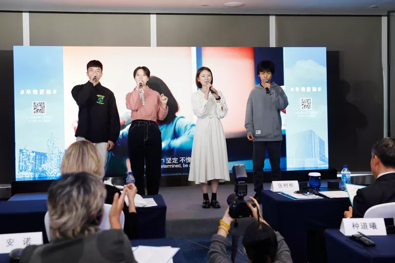(From left to right) Wang Zelong (20 years), Perry Kan (17 years), Yu Xinwei (18 years), and Li Simo (16 years) perform a song titled ‘A Stronger You’, which was adapted from the 1980s hit song Brother Louie by German band Modern Talking, at an event on adolescent mental health in Beijing on 12 October, 2021. The four adolescent girls and boys rewrote the lyrics and recorded a new version.