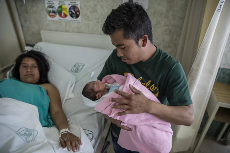 Zongolica, Veracruz, Feb 19th, 2017: Alejandro Cueyatle Ajacatle, 24, with his wife Angelica Cueyactle, 22 and newborn baby boy Alejandro Cueyatle Cueyatle, born at the Zongolica IMSS Prospera hospital in Zongolica, Veracruz, Mexico.