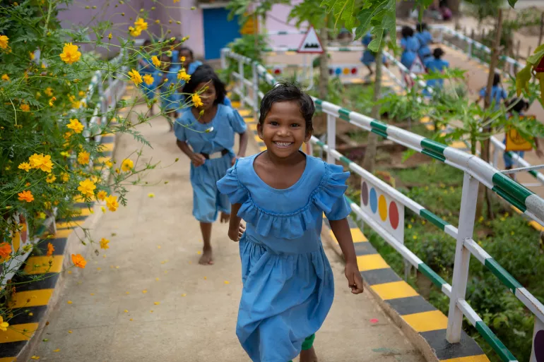 Deepika Jakaka, a 1st grader, plays with her classmates at the wonderfully green courtyard of the Ramachandrapur upper primary school in Rayagada district, Odisha. 