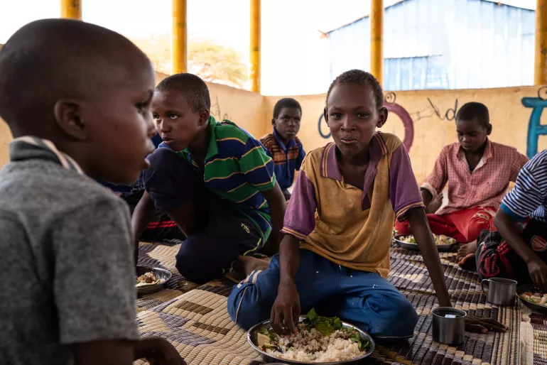 Children eat school-provided lunch at Qanshalay Primary School in Dollow, Somalia, Tuesday, April 23, 2018.