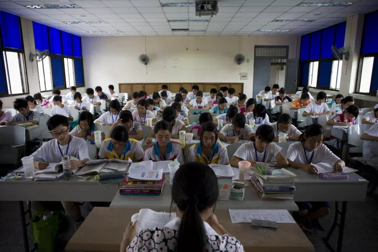 Adolescents study for their university entrance exams, at Sichuan University in Chengdu, the provincial capital. They have been orphaned or separated from their families by the earthquake and are living temporarily at the school.