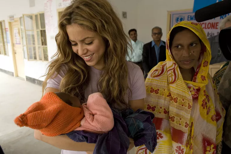 UNICEF Goodwill Ambassador Shakira holds a baby at an emergency relief distribution centre for people affected by Cyclone Sidr in Potuakhali District.