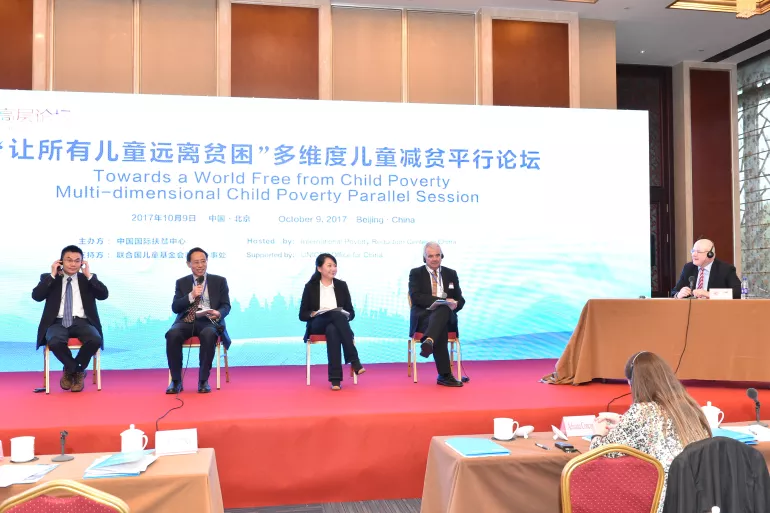 Experts join a panel discussion at a parallel session under the Global Poverty Reduction and Development Forum with the theme of “Towards a World Free from Child Poverty” in Beijing on 9 October, 2017.