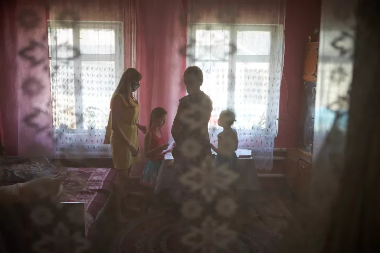 On 6 August 2020, psychologist Olena Davydova (left) meets with a family in Bilokurakyno, Eastern Ukraine.