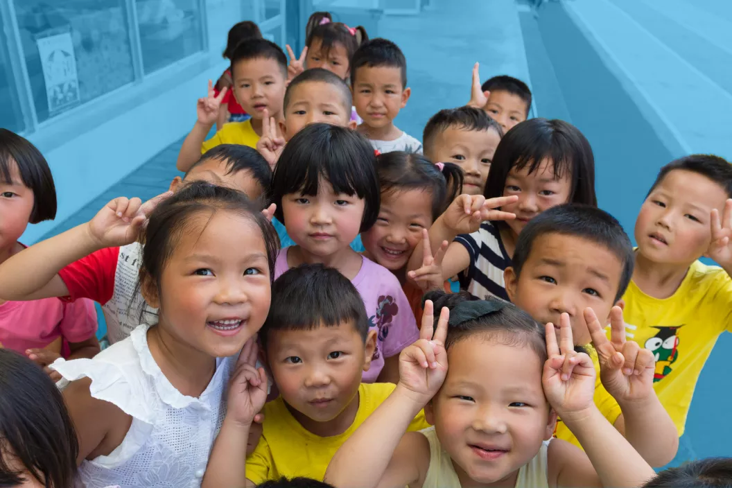 Children playing in schoolyard, China